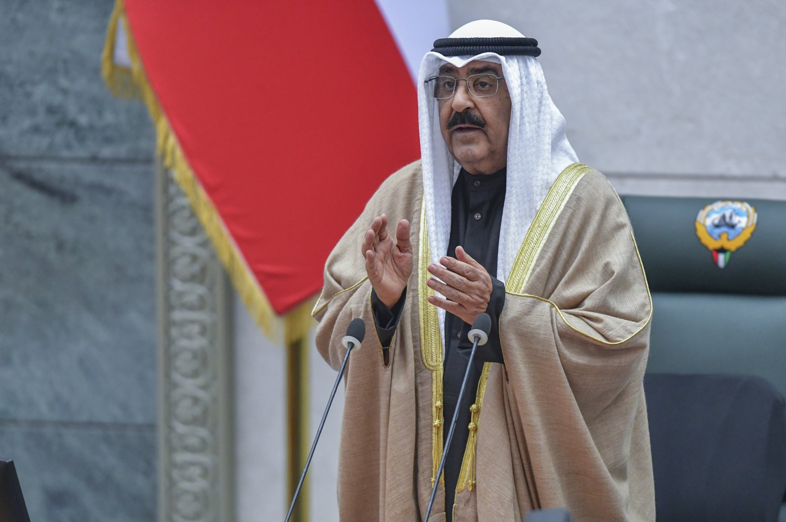 Kuwaiti Emir Sheikh Mishal Al Ahmad Al Jaber Al Sabah applauds during his oath ceremony at the National Assembly in Kuwait City, Kuwait, Dec. 20, 2023. (AP Photo)