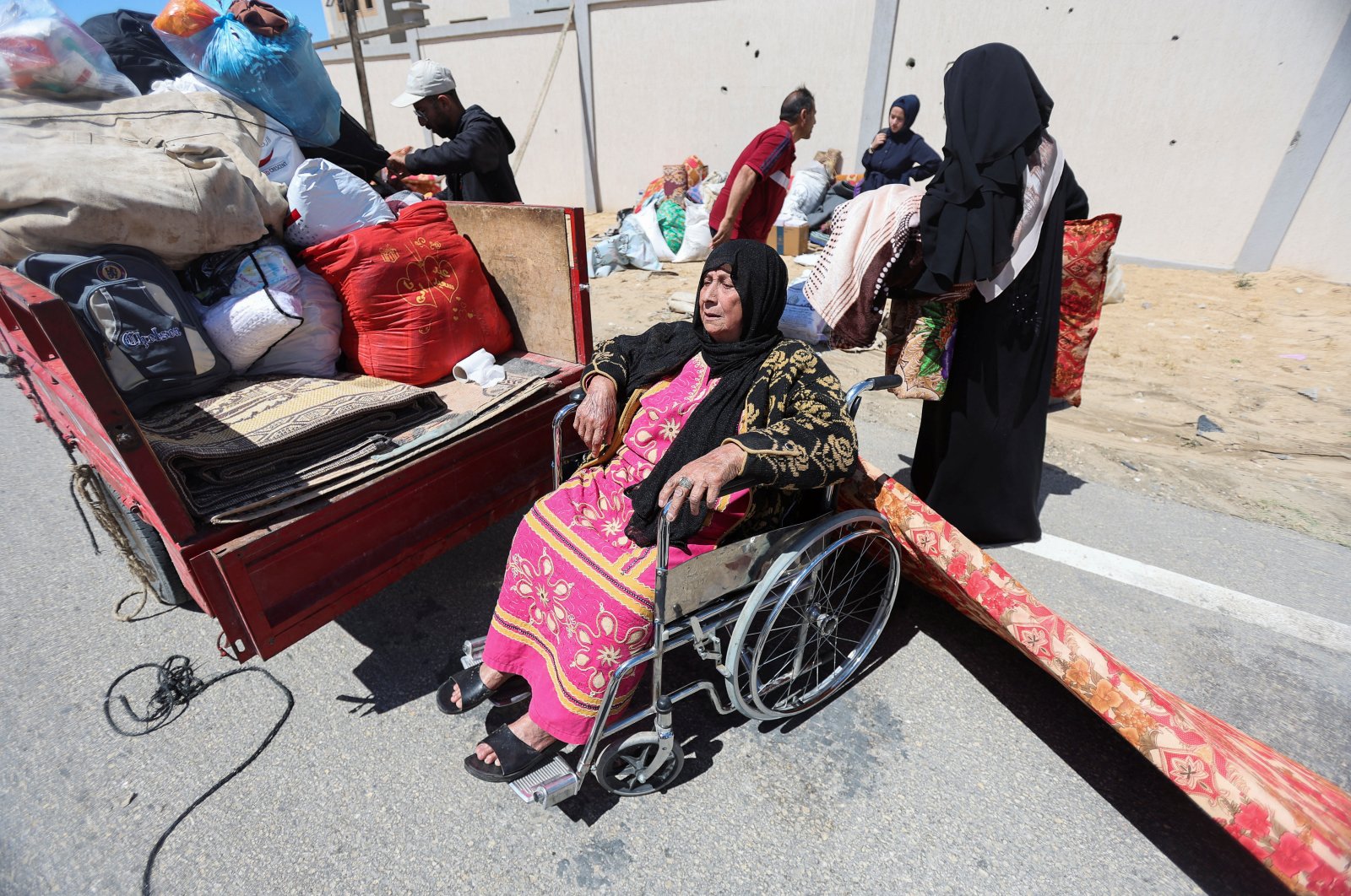 A displaced Palestinian woman, who fled Rafah after the Israeli military ordered civilians to evacuate from the eastern parts of the southern Gaza City, in the Al-Mawasi area, in Khan Younis in the southern Gaza Strip, May 6, 2024. (Reuters Photo)