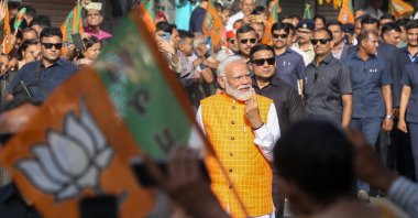 Indian Prime Minister Narendra Modi (C) shows his ink-marked finger after casting his vote for the third phase of general elections in Ahmedabad, Gujarat, western India, May 7, 2024. (EPA Photo)