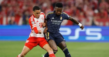 Bayern Munich's Jamal Musiala (L) and Real Madrid's Vinicius Junior vie for the ball during the UEFA Champions League semifinal first leg football match, Munich, Germany, April 30, 2024. (AFP Photo)