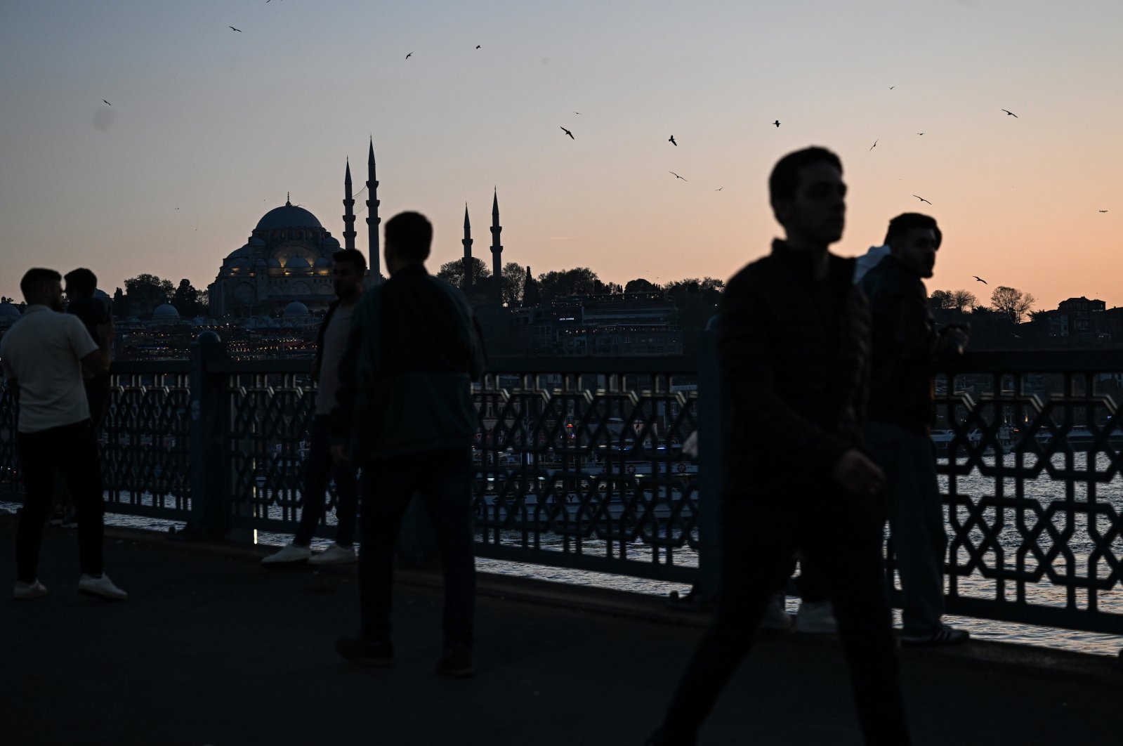 Tourists cross the Galata Bridge, Istanbul, Türkiye, April 10, 2024. (AA Photo)