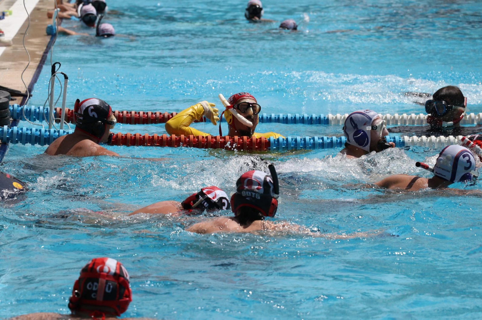Turkish underwater hockey team players in action during a training session, Adana, Türkiye, May 7, 2024. (AA Photo)