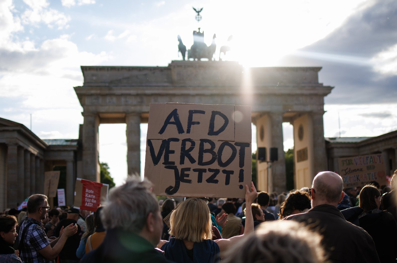 A participant holds a placard reading &quot;AFD ban now!&quot; referring to the far-right Alternative for Germany (AfD) party, during a rally in reaction to attacks on campaigning politicians in Germany, Berlin, Germany, May 5, 2024. (EPA Photo)