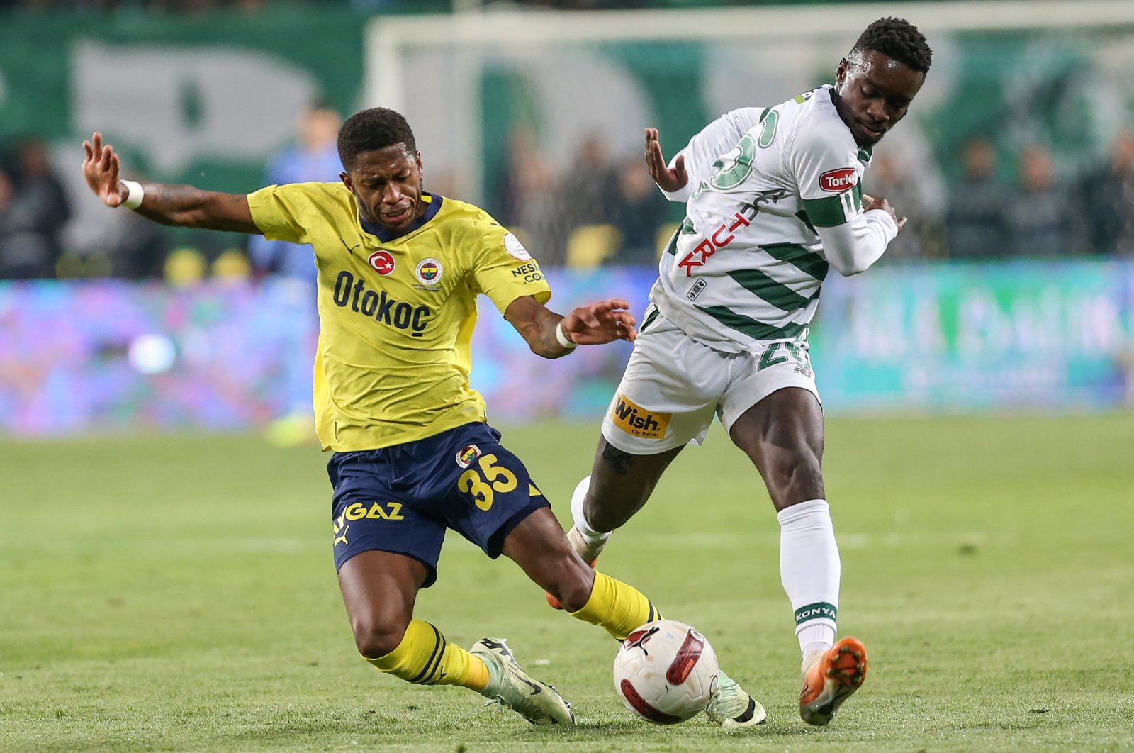 Fenerbahçe&#039;s Fred (L) and Konyaspor&#039;s Emmanuel Boateng vie for the ball during the Süper Lig match at the Medaş Konya Büyükşehir Stadium, Konya, Türkiye, May 6, 2024. (AA Photo)