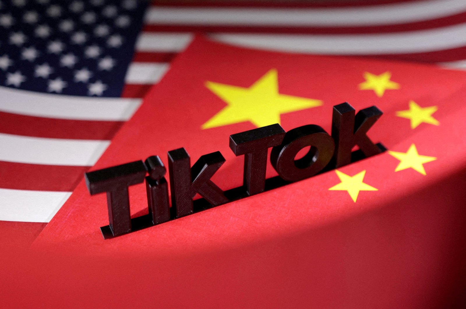 TikTok logo is placed on the U.S. and Chinese flags in this illustration taken, April 25, 2024. (Reuters File Photo)
