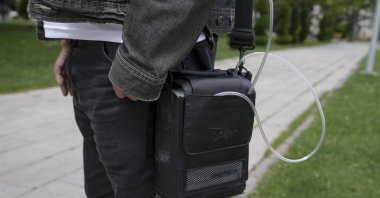 Aykut Inciler manages pulmonary hypertension with an artificial lung device, Ankara, Türkiye, May 7, 2024. (AA Photos)