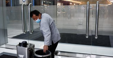 Cleaning worker Hu Dexi, 67, works at a shopping mall in Beijing, China, April 10, 2024. (Reuters Photo)