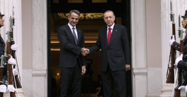 Greek Prime Minister Kyriakos Mitsotakis welcomes President Recep Tayyip Erdoğan before their meeting at Maximos Mansion in Athens, Greece, Dec. 7, 2023. (AP Photo)