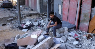 A boy sits amid rubble at the site of a building that was hit by Israeli bombardment in Rafah in the southern Gaza Strip, Palestine, May 8, 2024. (AFP Photo)