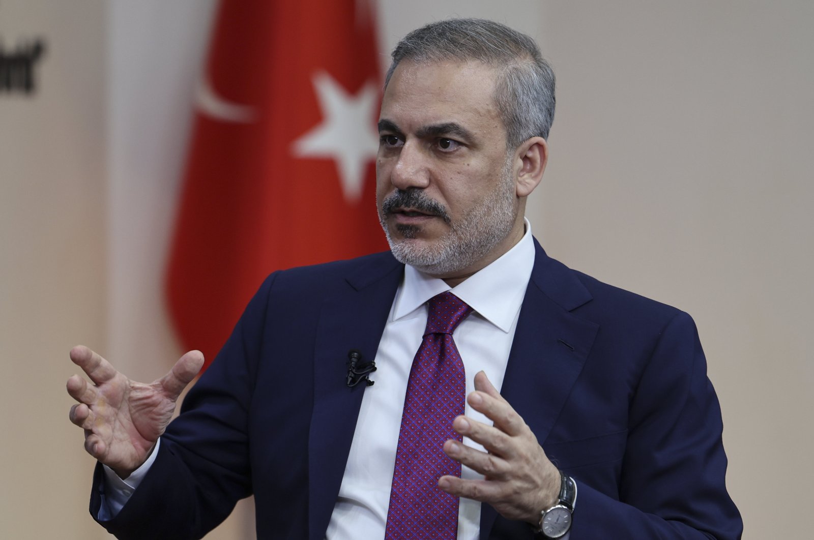 Foreign Minister Hakan Fidan gestures during an interview with Al-Arabiya at the Foreign Ministry, Ankara, Türkiye, May 5, 2024. (AA Photo)