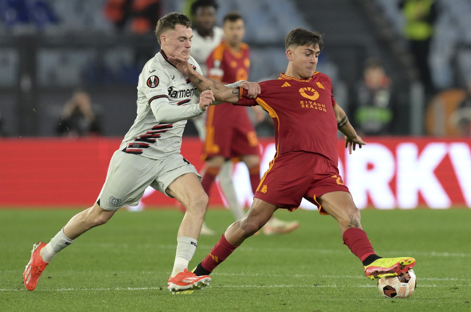 Roma&#039;s Paulo Dybala (R) drives the ball during the UEFA Europa League semifinal first leg match between AS Roma and Bayer 04 Leverkusen at the Olympic stadium, Rome, Italy, May 2, 2024. (AP Photo)