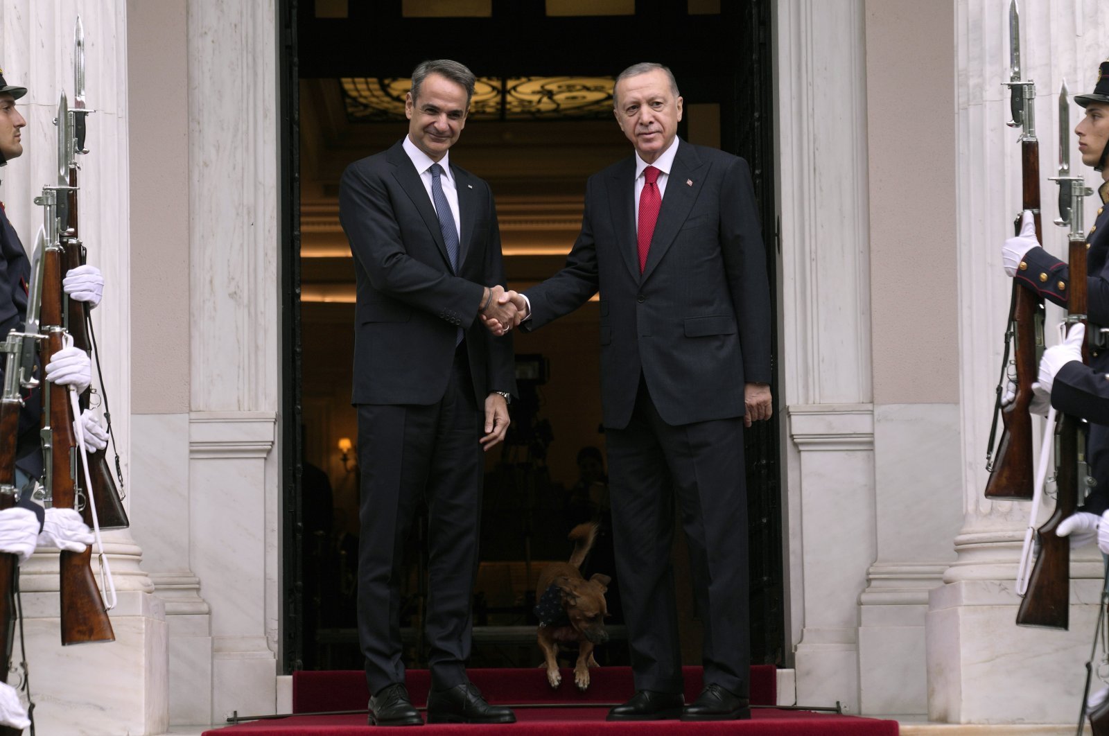 Greek Prime Minister Kyriakos Mitsotakis welcomes President Recep Tayyip Erdoğan before their meeting at Maximos Mansion in Athens, Greece, Dec. 7, 2023. (AP Photo)