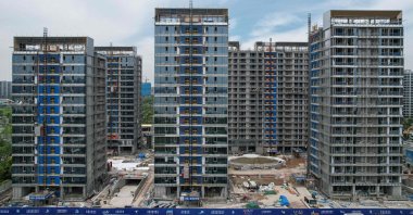 This picture shows residential buildings under construction by Chinese real estate developer Vanke in Hangzhou, eastern Zhejiang province, China, May 9, 2024. (AFP Photo)