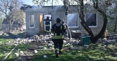 Firefighters put out a fire in a destroyed private house after the explosion of a guided aerial bomb in Kharkiv, Ukraine, May 3, 2024. (AFP Photo)