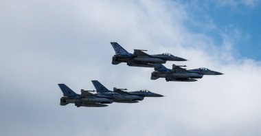 F-16 flight jets fly over Lisbon during the military ceremony marking the Carnation Revolution 50th anniversary, Portugal, April 25, 2024. (EPA Photo)