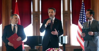 Energy and Natural Resources Minister Alparslan Bayraktar (C) delivers a speech during a signing ceremony on the LNG deal between BOTAŞ and ExxonMobil, Washington, United States, May 8, 2024. (AA Photo)