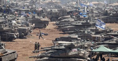 Israeli military vehicles gather at an undisclosed position near the border fence with the Gaza Strip, in southern Israel, May 9. 2024. (EPA Photo)