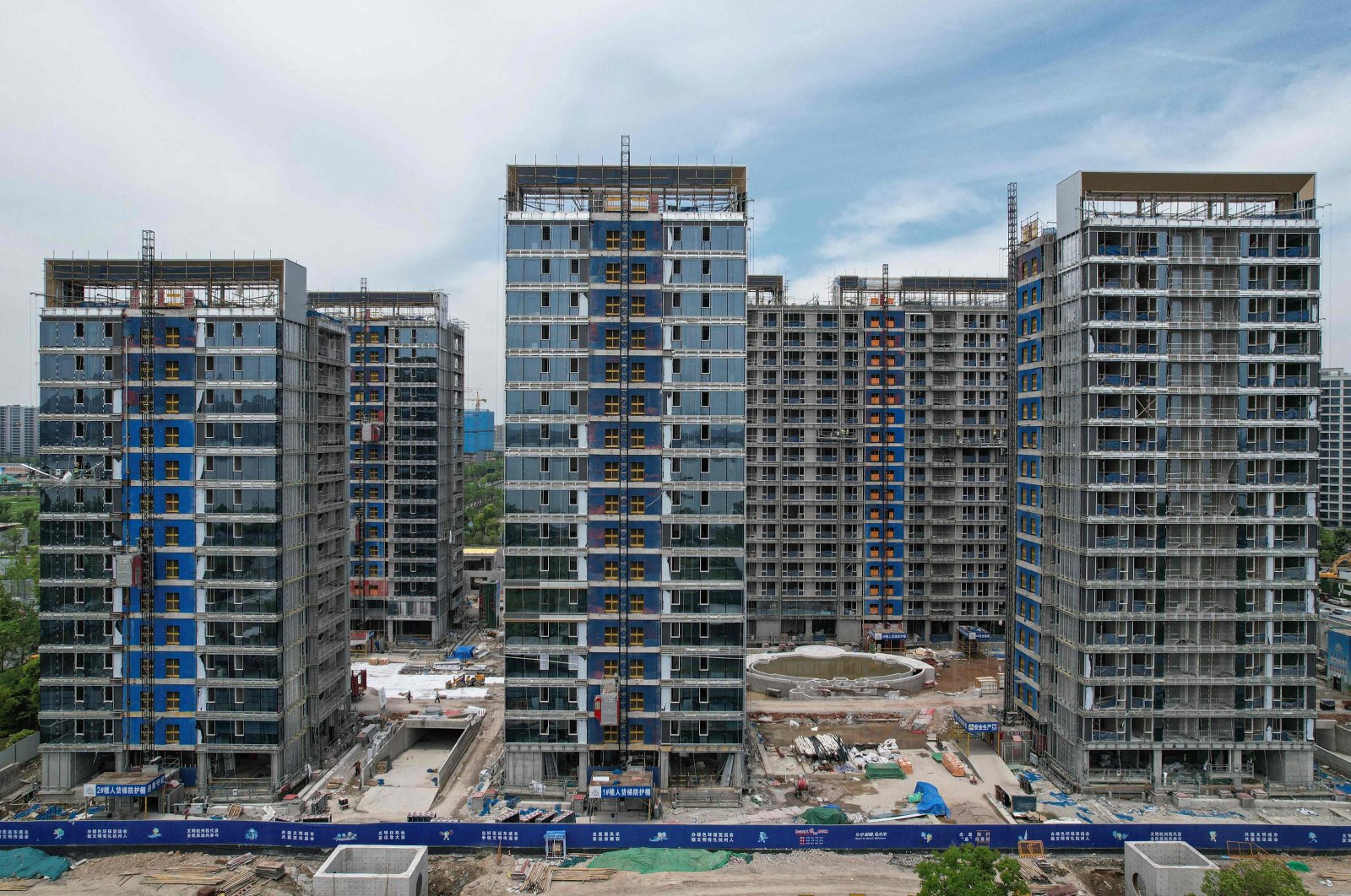 This picture shows residential buildings under construction by Chinese real estate developer Vanke in Hangzhou, eastern Zhejiang province, China, May 9, 2024. (AFP Photo)