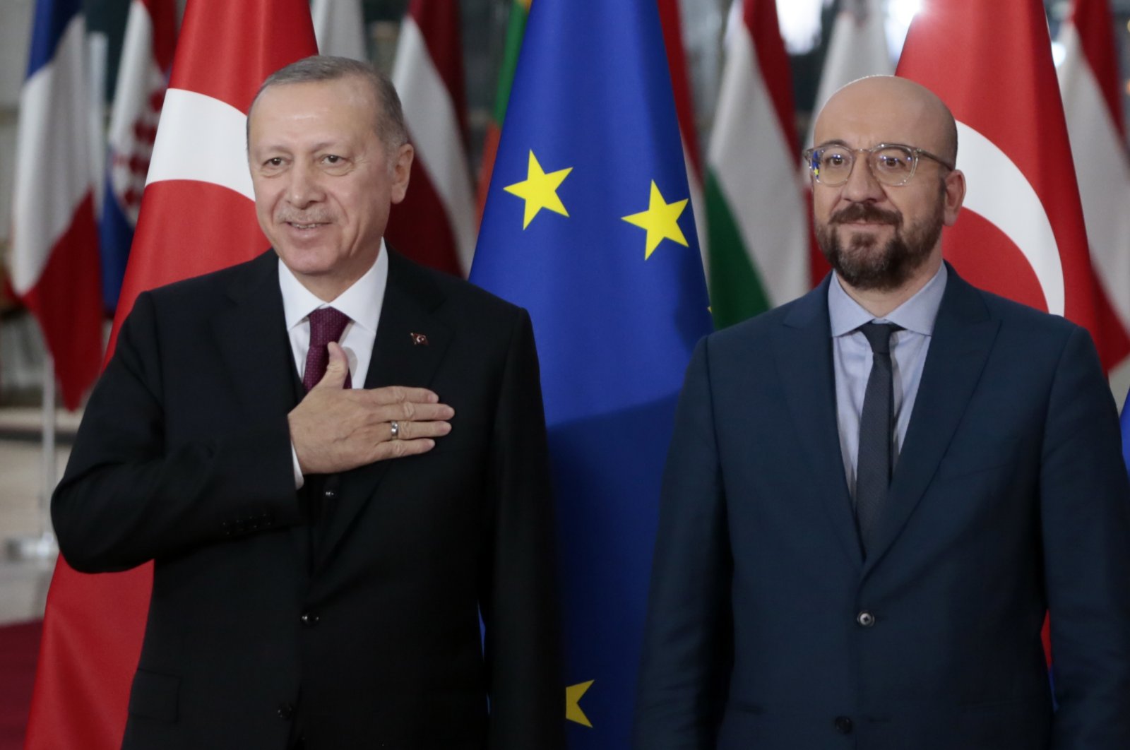 President Recep Tayyip Erdoğan (L) is welcomed by European Council President Charles Michel prior to a meeting, Brussels, Belgium, March 9, 2020. (AP Photo)