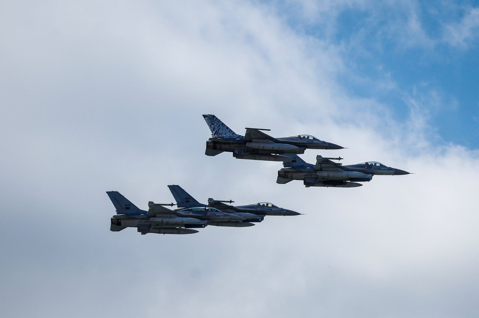 F-16 flight jets fly over Lisbon during the military ceremony marking the Carnation Revolution 50th anniversary, Portugal, April 25, 2024. (EPA Photo)