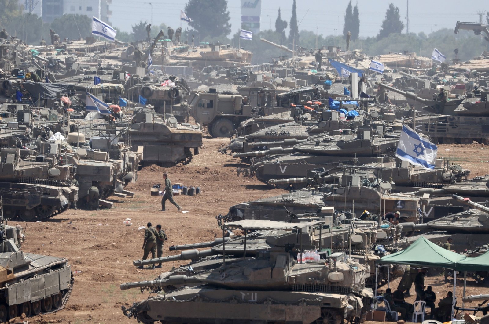 Israeli military vehicles gather at an undisclosed position near the border fence with the Gaza Strip, in southern Israel, May 9. 2024. (EPA Photo)