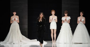 Seyhan Merve Şişman walks the runway with some of her bridal wear designs, which she has been designing in Australia for 10 years, eventually expanding her designs to more than 40 sales points in seven countries, Milan, Italy, April 7, 2024. (Sabah Photo)