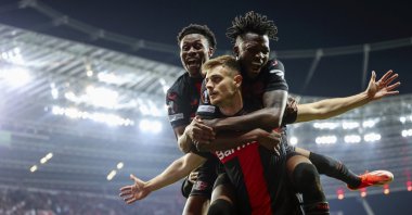 Bayer Leverkusen's Josip Stanisic (C) celebrates with teammates after scoring the 2-2 equalizer during the UEFA Europa League semifinal second leg match between against Roma, Leverkusen, Germany, May 9, 2024. (EPA Photo)