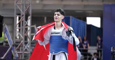 Turkish athlete Furkan Ubeyde Çamoğlu celebrates after beating Greece's Konstantinos Dimitropoulos to win the European Taekwondo Championships gold, Belgrad, Serbia, May 9, 2024. (AA Photo)