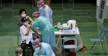 People receive a vaccine against the COVID-19 pandemic during a vaccination session for elderly people over 85 years old, at a sports stadium in New Taipei City, Taiwan, June 15, 2021. (Reuters Photo)