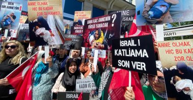 Protestors carry banners and placards denouncing Israel during a rally in Ankara, Türkiye, May 9, 2024. (DHA Photo)