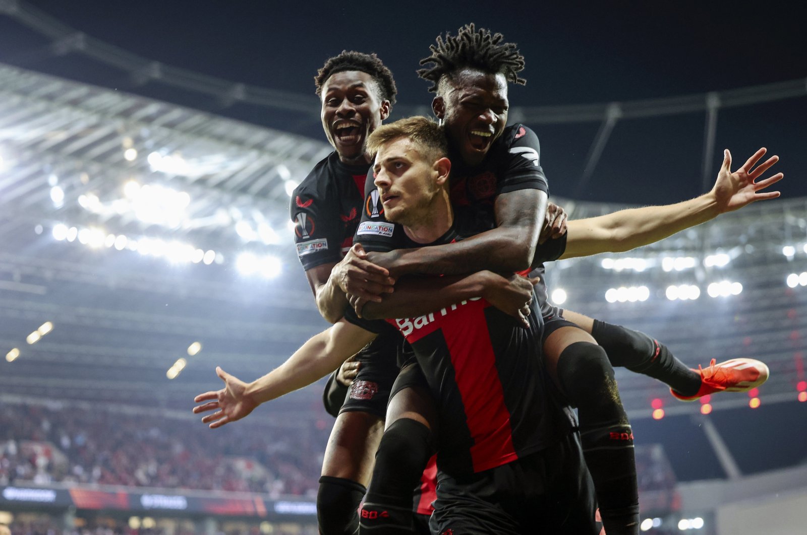 Bayer Leverkusen&#039;s Josip Stanisic (C) celebrates with teammates after scoring the 2-2 equalizer during the UEFA Europa League semifinal second leg match between against Roma, Leverkusen, Germany, May 9, 2024. (EPA Photo)