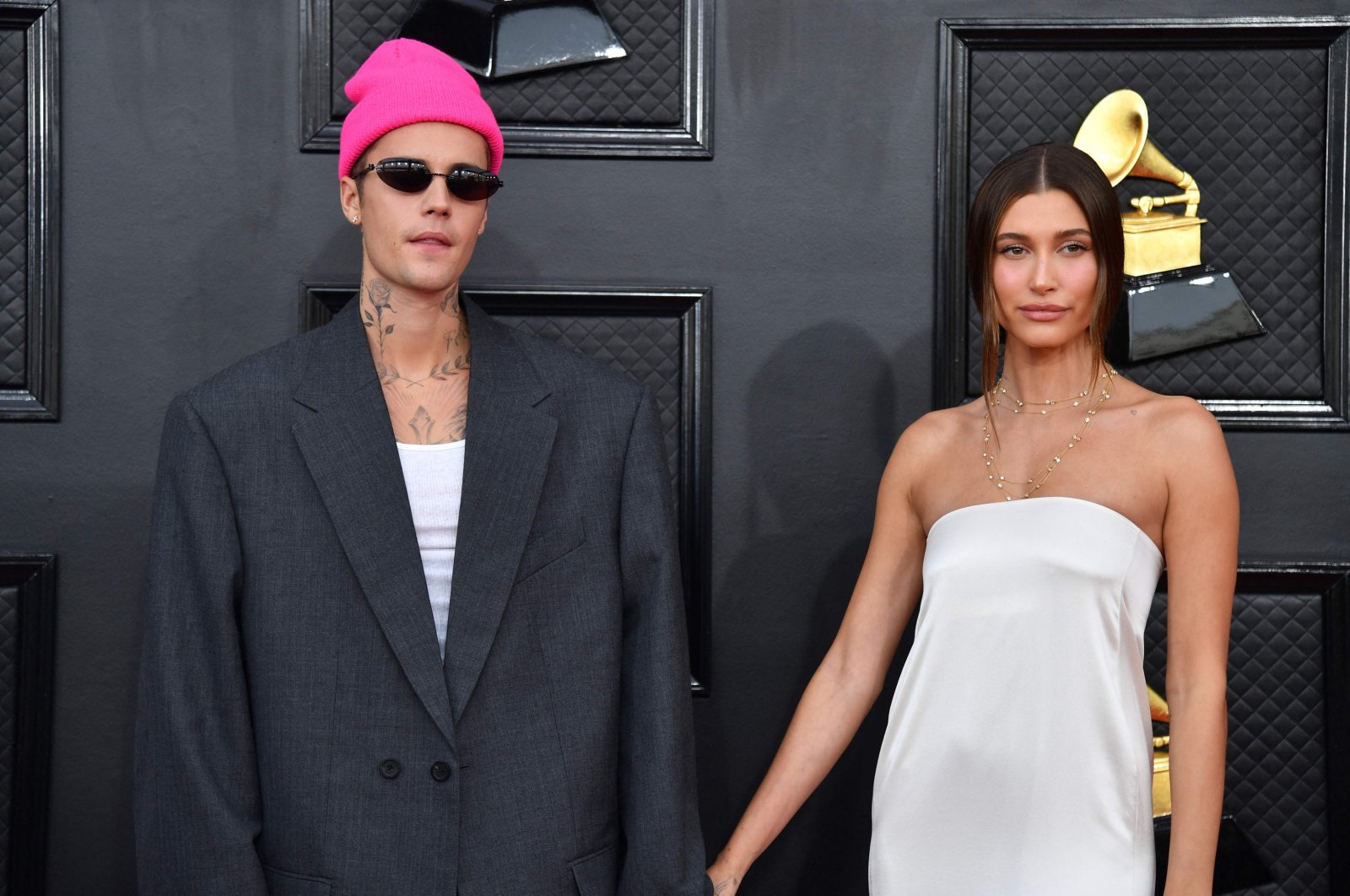 Canadian singer-songwriter Justin Bieber (L) and U.S. model Hailey Bieber arrive for the 64th Annual Grammy Awards at the MGM Grand Garden Arena, Las Vegas, U.S., April 3, 2022. (AFP Photo)