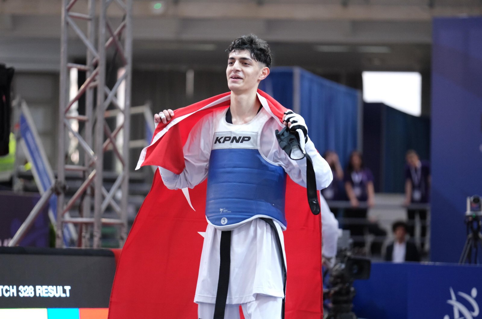 Turkish athlete Furkan Ubeyde Çamoğlu celebrates after beating Greece&#039;s Konstantinos Dimitropoulos to win the European Taekwondo Championships gold, Belgrad, Serbia, May 9, 2024. (AA Photo)