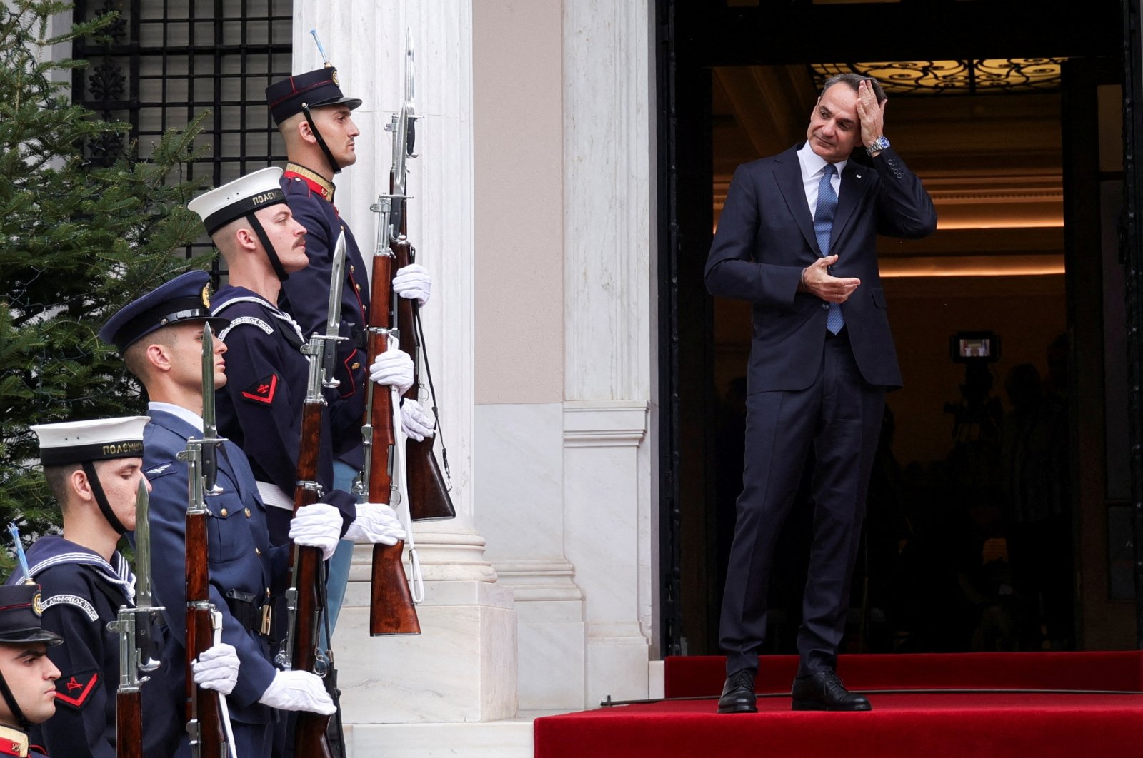 Greek Prime Minister Kyriakos Mitsotakis gestures, as he waits to welcome Turkish President Tayyip Erdoğan at Maximos Mansion, Athens, Greece, Dec. 7, 2023. (Reuters Photo)