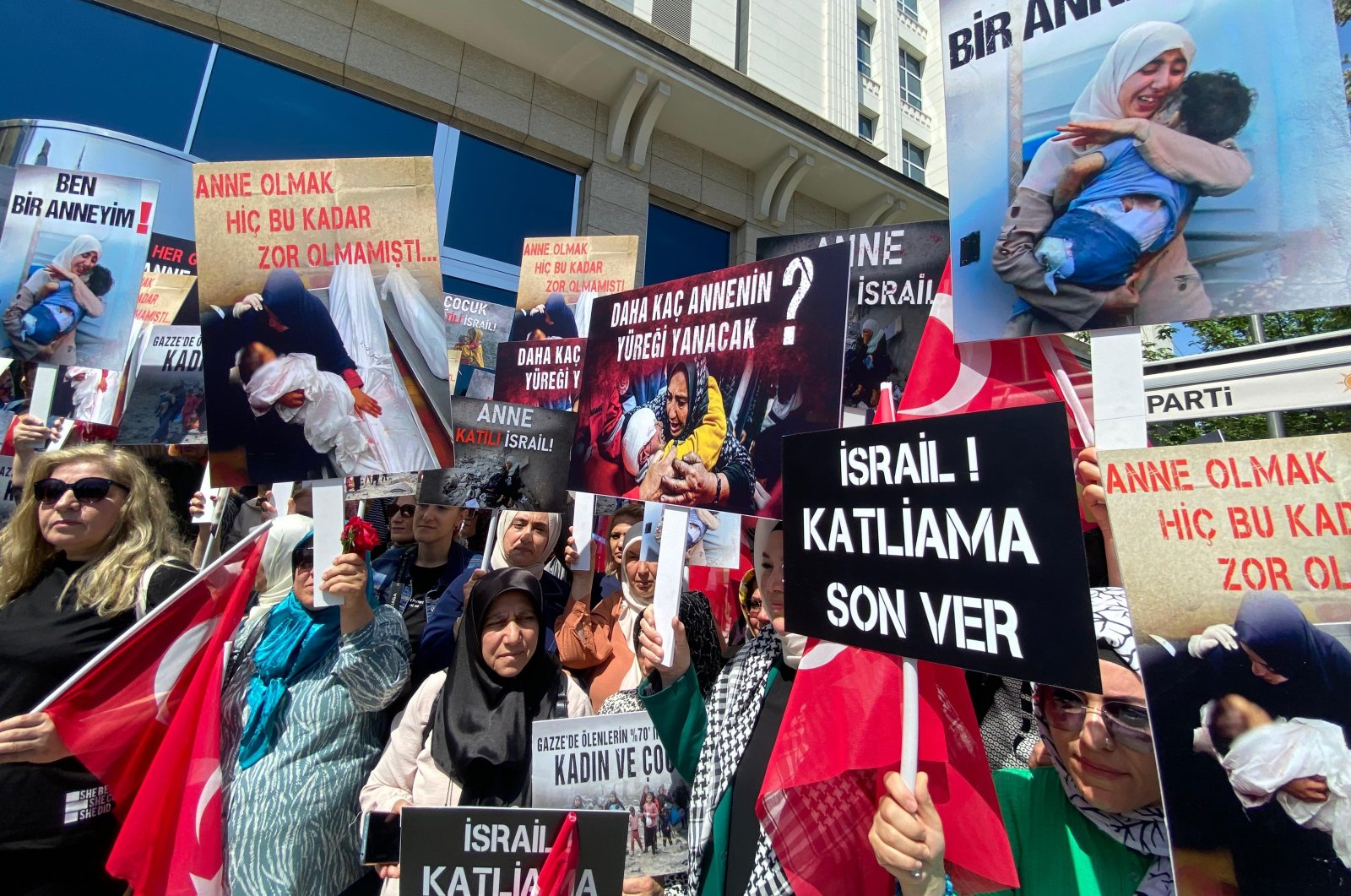 Protestors carry banners and placards denouncing Israel during a rally in Ankara, Türkiye, May 9, 2024. (DHA Photo)