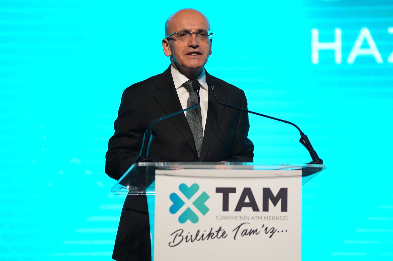 Treasury and Finance Minister Mehmet Şimşek speaks during an event in Istanbul, Türkiye, May 10, 2024. (AA Photo)