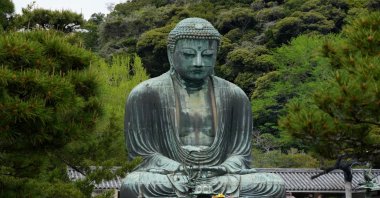 Tourists visit Kotokuin Temple to view and pray at the 13.35-meter (43.80-foot) tall Great Buddha of Kamakura, in Kamakura, south of Tokyo, Japan, April 21, 2024. (EPA Photo)