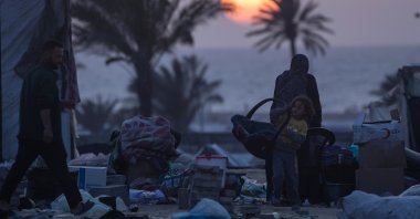 Internally displaced Palestinians prepare to leave with their belongings after an evacuation order issued by the Israeli army, near the Egyptian border in Rafah, southern Gaza Strip, Palestine, May 11, 2024. (EPA Photo)