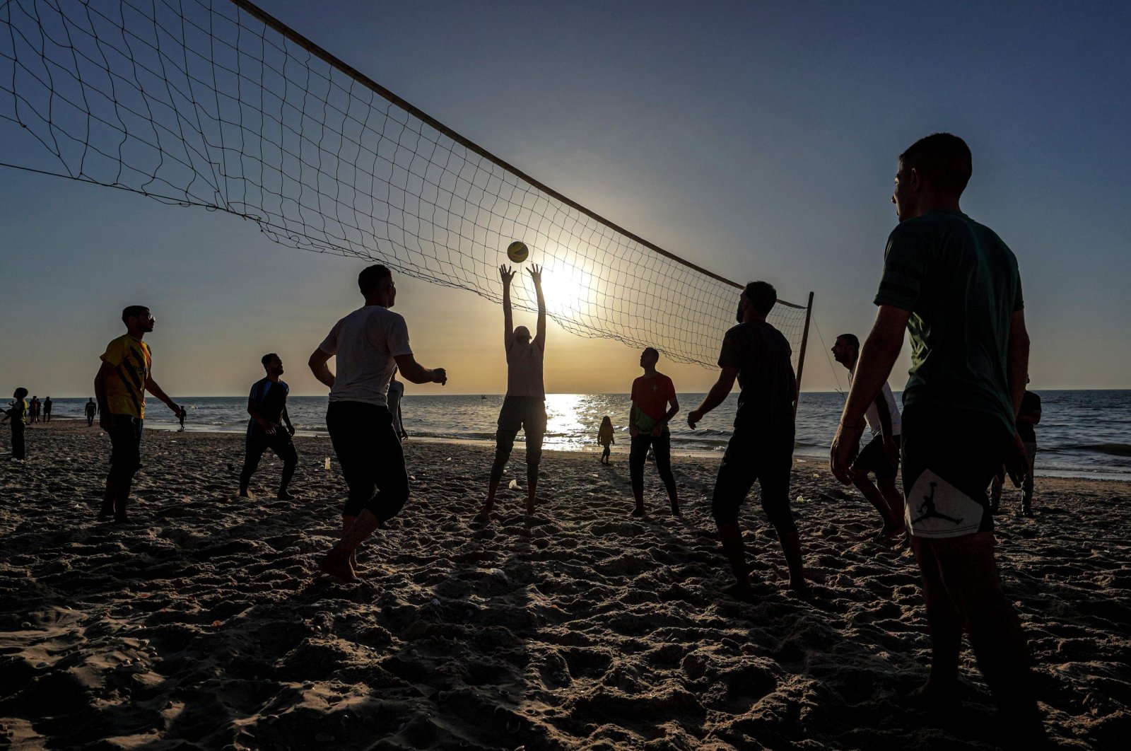 Palestinians play volleyball on a beach in Deir al-Balah in the central Gaza Strip, Palestine, April 17, 2024. (AFP Photo)