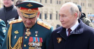 Russian President Vladimir Putin (R) with Defense Minister Sergei Shoigu (L) walk after a military parade on Victory Day, in Red Square in Moscow, Russia, May 9, 2024. (EPA Photo)