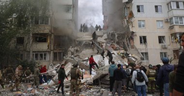 Russian firefighters and volunteers operate to secure the area on the site of a partially collapsed apartment building hit by a Ukrainian strike in Belgorod, Russia, May 12, 2024. (AFP Photo)