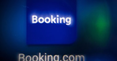 This picture shows the logo of the online reservation platform Booking.com on a tablet screen, Moscow, Russia, Nov. 11, 2021. (AFP Photo)
