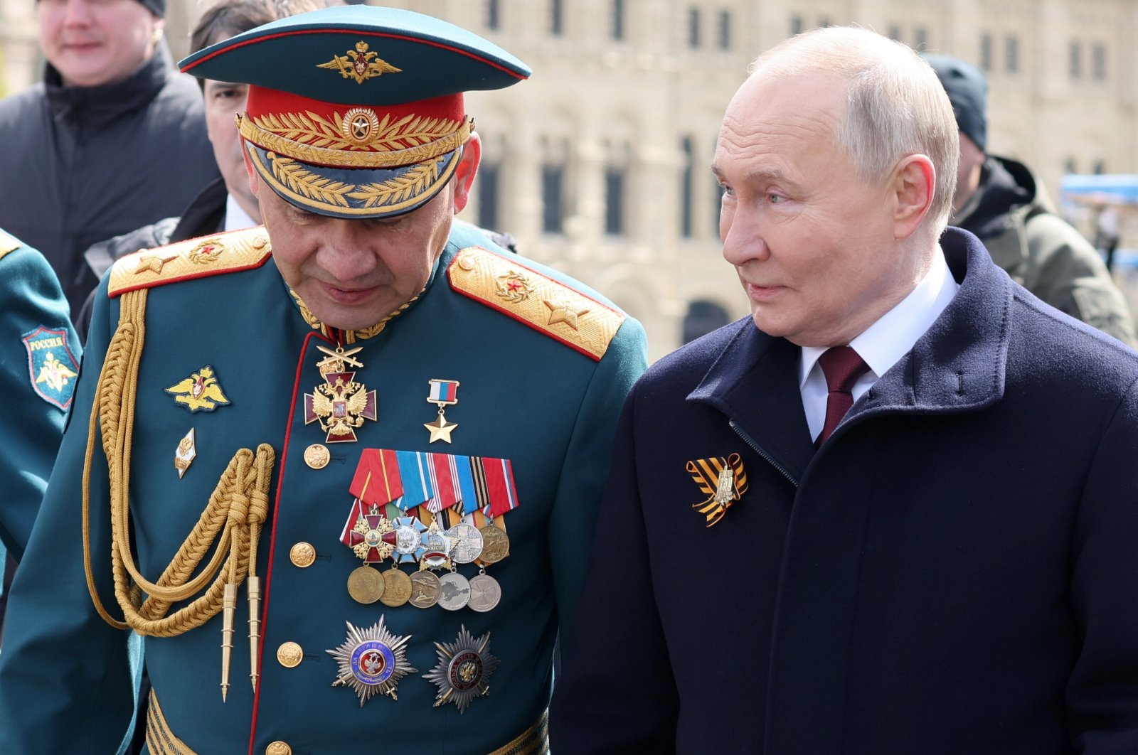 Russian President Vladimir Putin (R) with Defense Minister Sergei Shoigu (L) walk after a military parade on Victory Day, in Red Square in Moscow, Russia, May 9, 2024. (EPA Photo)