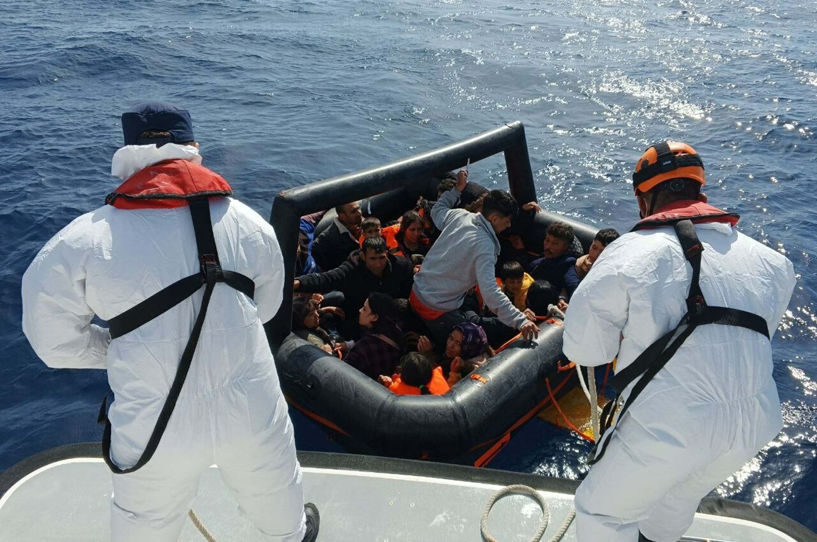 Turkish coast guard crews help irregular migrants off the coast of Ayvacık, Çanakkale, western Türkiye, May 13, 2024. (DHA Photo)