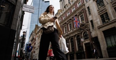 A person walks in the City of London financial district, London, Britain, April 23, 2024. (EPA Photo)