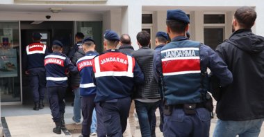 Turkish gendarmerie escort to the courthouse seven suspected terrorists, including four FETÖ members caught trying to flee abroad in northwestern Edirne province, Türkiye, April 18, 2024. (AA Photo)