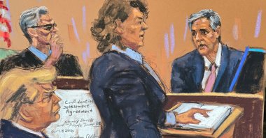 Michael Cohen is questioned by Prosecutor Susan Hoffinger before Justice Juan Merchan as former U.S. President Donald Trump watches, in Manhattan state court, New York City, U.S. May 13, 2024. (Reuters Photo)