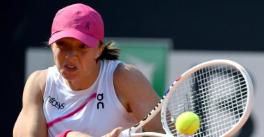 Poland's Iga Swiatek in action during her women's singles fourth round match against Germany's Angelique Kerber at the Italian Open, Rome, Italy, May 13, 2024. (EPA Photo)