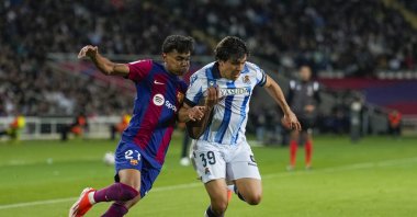 FC Barcelona's Lamine Yamal (L) in action against Real Sociedad's Jon Aramburu during the Spanish LaLiga match at Lluis Companys stadium in Barcelona, Spain, May 13, 2024. (EPA Photo)