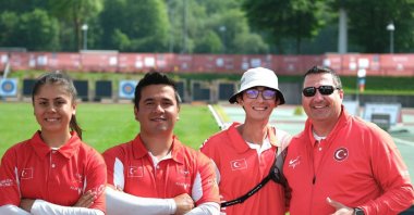 From left to right, Turkish archery team of Hazla Burun, Emircan Haney, Mete Gazoz and their coach pose for a photo during the European Archery Championships, Essen, Germany, May 10, 2024. (AA Photo)